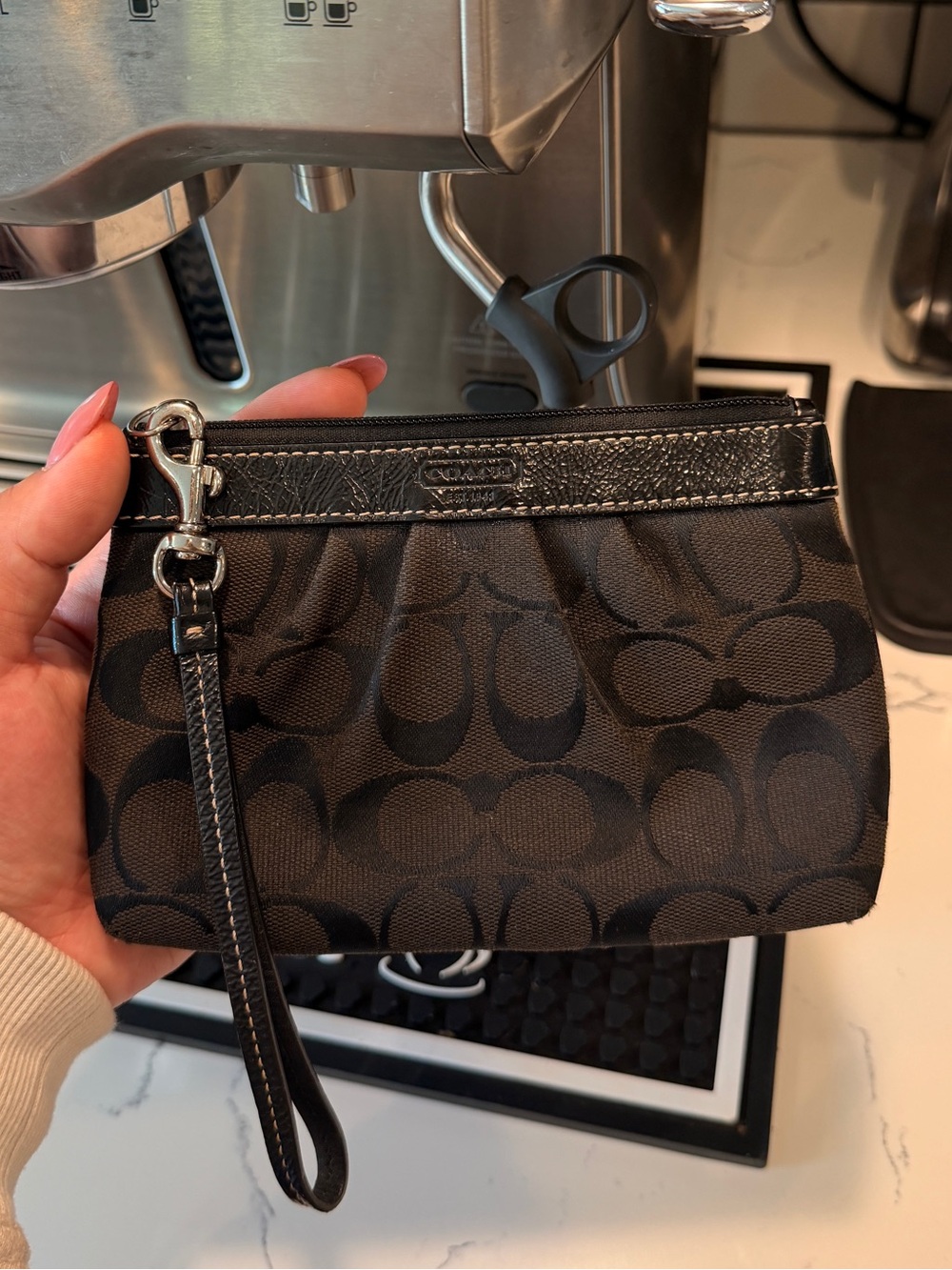Coach Signature pleated wristlet in black canvas with patent leather trim